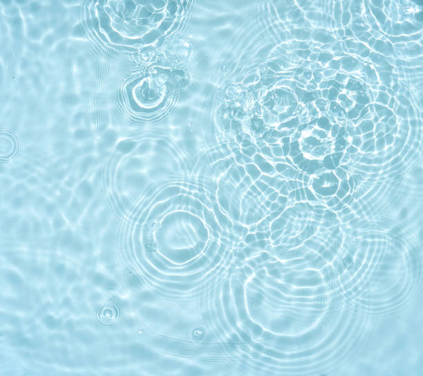 istock Original light background image with a water surface and waves in the form of rings. 1435634388