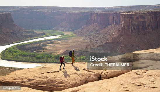 istock Young couple walking in Moab Park, USA 1435634685