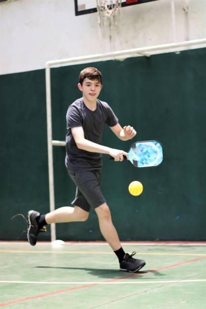 istock teenager playing pickleball 1435636278