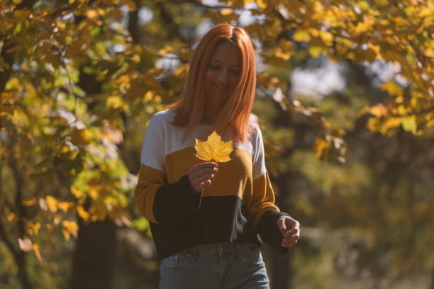 Woman enjoy in sunny weather in autumn