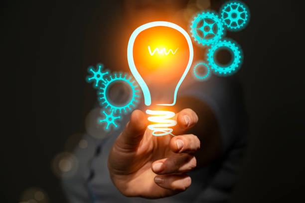 istock New technology invention concept, innovation and development, engineer in hand holding light bulb with gears icons 1435636936