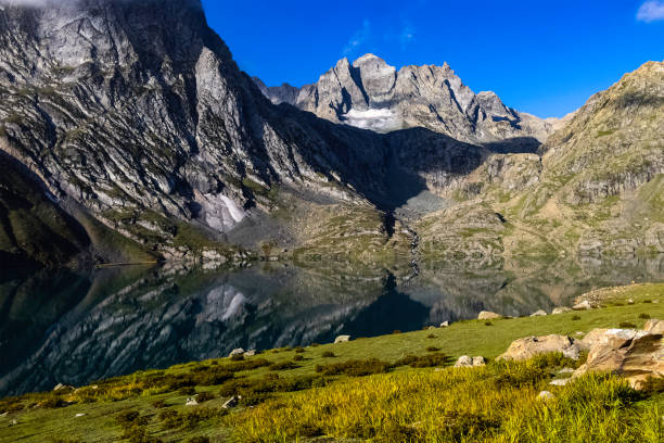 istock Beautiful mountain scenery. River, reflection, valley, snow, blue sky, white clouds. In-depth trip on the Sonamarg Hill Trek in Jammu and Kashmir, India 1435637082