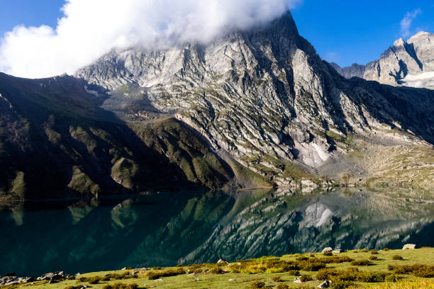 istock Beautiful mountain scenery. River, reflection, valley, snow, blue sky, white clouds. In-depth trip on the Sonamarg Hill Trek in Jammu and Kashmir, India 1435640665