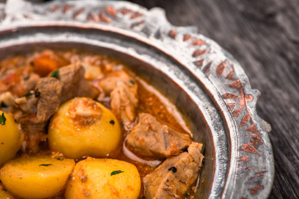 istock Eid Mubarak Traditional Ramadan Iftar dinner. Assorted tasty food in authentic rustic dishes on wooden blue background. Turkish Bosnian food meat kebab, pita, Sarma, klepe, sogan dolma. 1435642423
