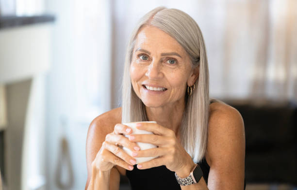 istock Beautiful Senior Woman enjoying Breakfast Coffee 1435644105