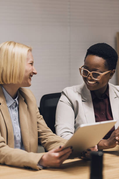 istock Multiracial female colleagues happy with their project 1435646257
