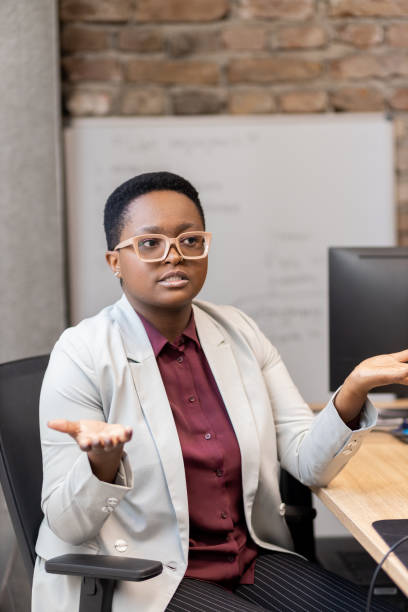 istock Young businesswoman asking for help at work 1435646498