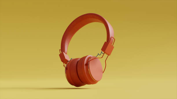 istock Orange Headphones on a Yellow Background 1435647717