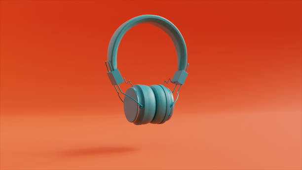 istock Turquoise Headphones on an Orange Background 1435649642