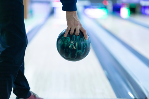 Bowling.A man is playing bowling.Recreation and entertainment.