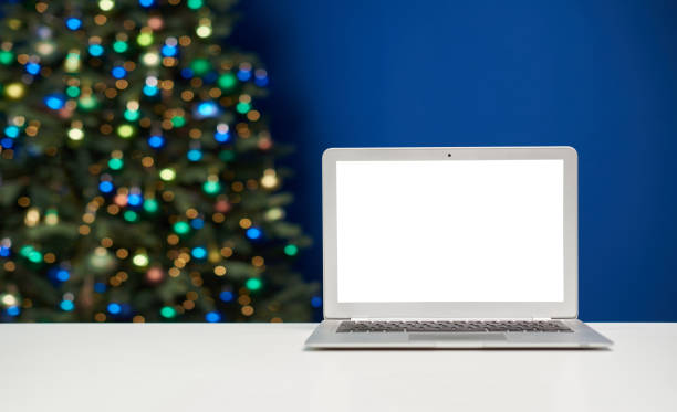 istock Laptop mockup template with empty screen against christmas lights 1435654977