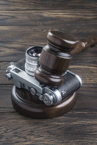 Judge's gavel and vintage camera. Privacy concept
