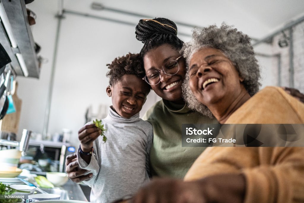 Happy family cooking at home Family Stock Photo