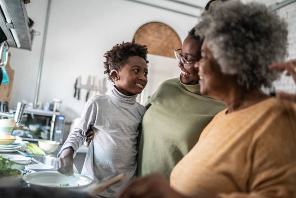 istock Family embracing while cooking at home 1435656524