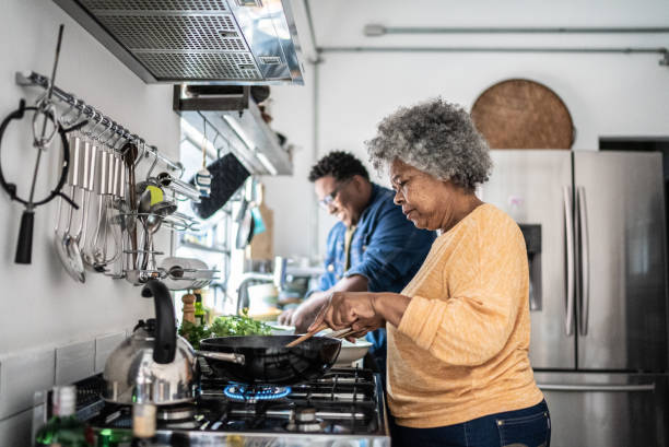 istock Mother and son cooking in the kitchen at home 1435656546