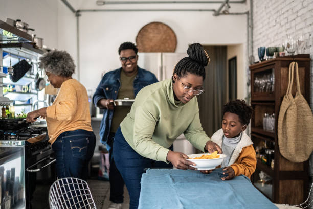 istock Family setting the table and preparing the lunch at home 1435656570