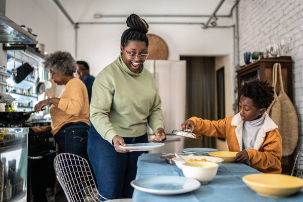 istock Family setting the table and preparing the lunch at home 1435656574