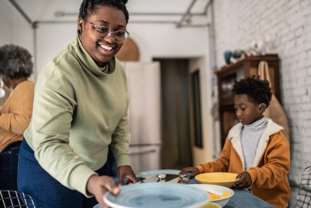 istock Family setting the table and preparing the lunch at home 1435656579