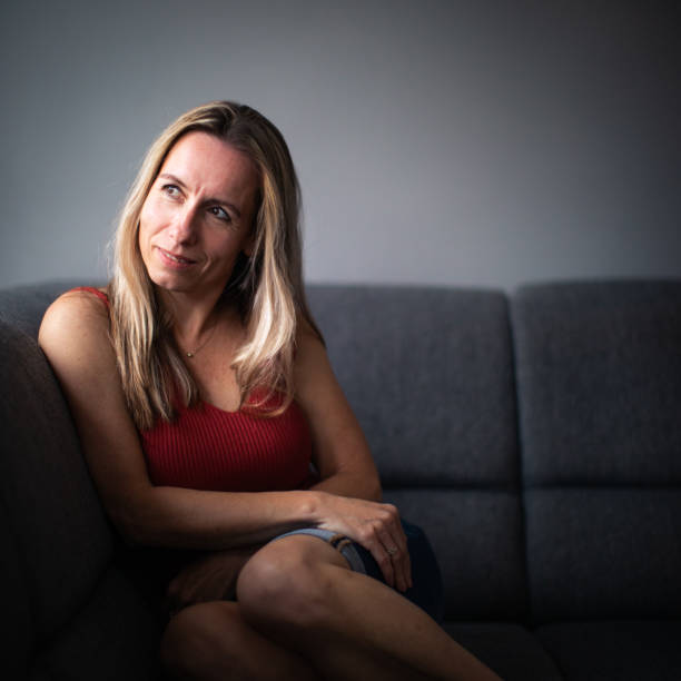 istock Depressed mid-aged woman at home feeling sad, lonely, anxious (color toned image) 1435656596
