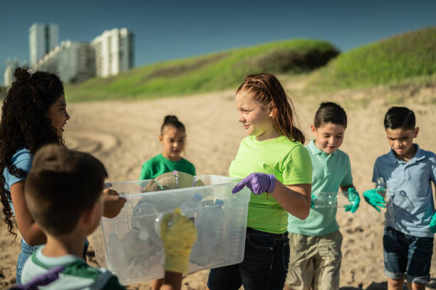 istock Children collecting garbage at the beach 1435661766