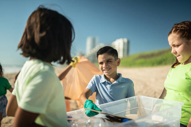 istock Children collecting garbage at the beach 1435661833