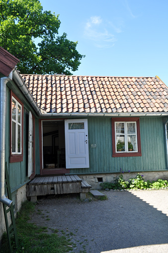 Oslo, Norway - July 17, 2021: Old wooden and brick buildings on Bygdoy peninsula. Norwegian open-air museum in Oslo.