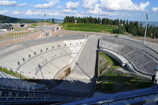 Oslo, Norway - Holmenkollen ski jumps with a grandstand and a view of the city