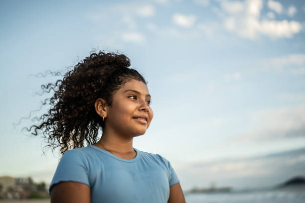 istock Girl contemplating at the beach 1435662556