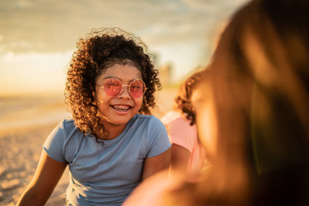istock Girls talking at sunset on the beach 1435663298