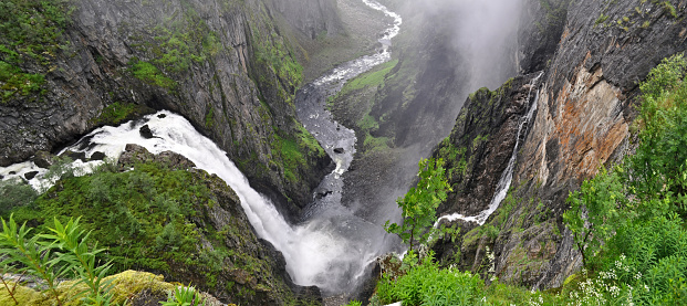 Vøringsfossen, Norway - a waterfall falling from a rock down into a canyon.