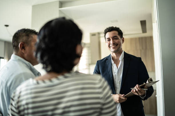 istock Real estate agent showing house to a customer 1435664349