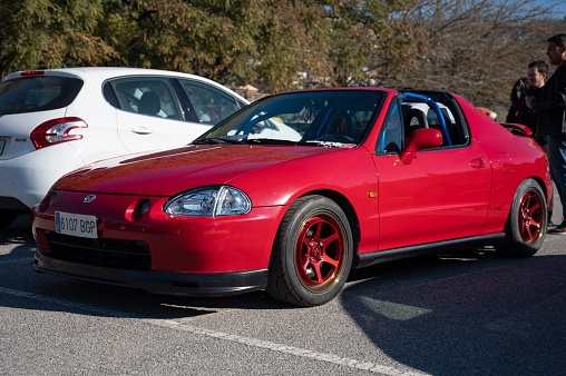 Barcelona, Spain – August 20, 2022: A tuned and improved red Honda CRX Del Sol car