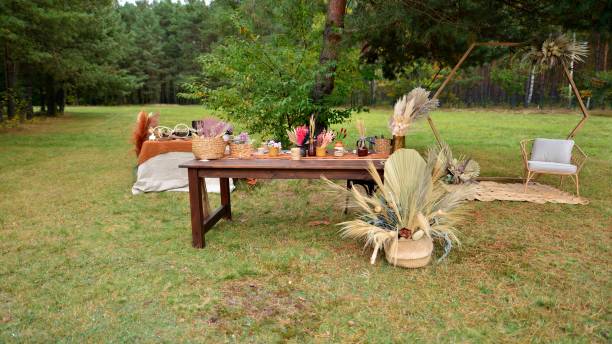istock Wedding ceremony area in boho style with dried flowers. outdoor wedding. 1435667657