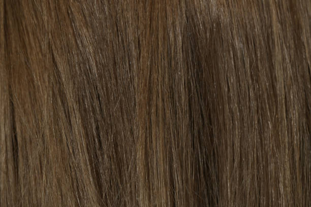 istock Natural brown hair background, close up 1435669606