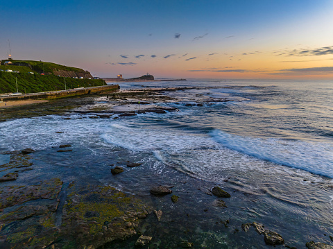 Sunrise over the ocean at Flat Rock beach nxt to the ocean baths in Newcastle, NSW, Australia.