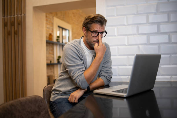 istock Mid adult man working from home 1435678552