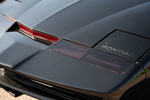Barcelona, Spain – August 20, 2022: A closeup of the red light of the black Pontiac Trans AM