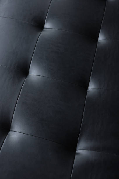 sfondo testurizzato in pelle nera con bottone - macro chair domestic room contemporary foto e immagini stock