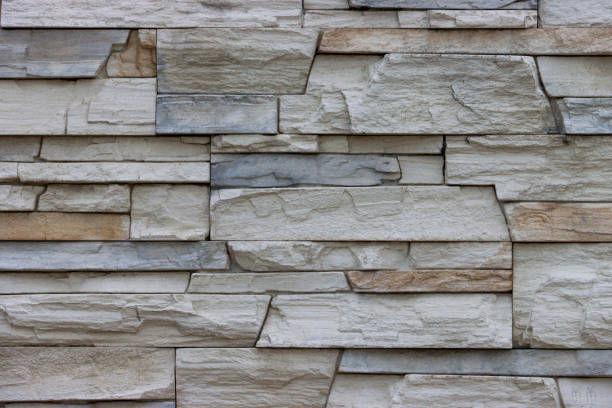 istock Background of a wall made of bricks of different sizes. 1435694405