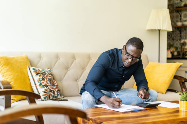 istock A man is adding up his household expenses 1435694480