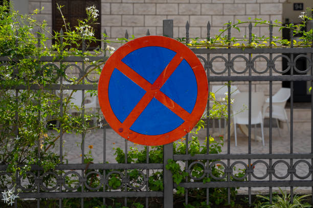 istock A round road sign indicating a place where vehicle parking is prohibited. tools for regulating traffic rules. 1435694610