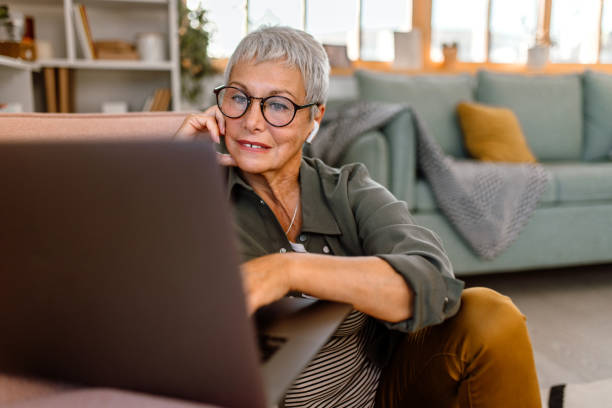 istock Senior woman using laptop for video call 1435698661
