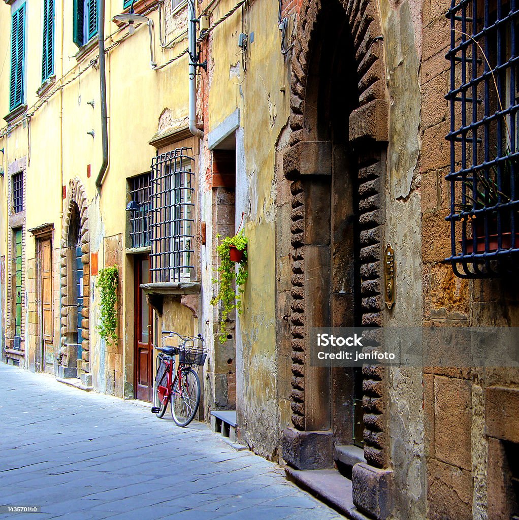 Old medieval street in Italy Old medieval street in Tuscany, Italy Alley Stock Photo