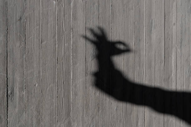istock The effect of hand shadow on the wall 1435710970