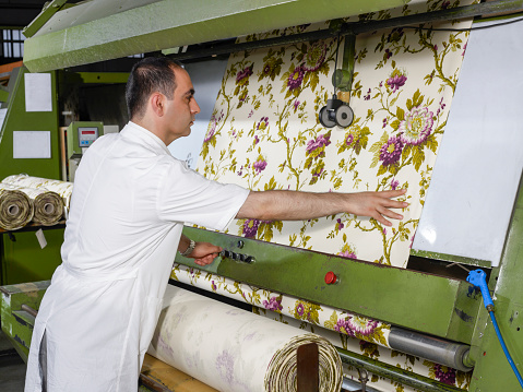 Quality controller working in a textile factory