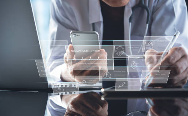 istock Electronic health record system EHRs, medical technology concept. Doctor using digital tablet and laptop computer with medical record and patient's information on virtual screen 1435729153
