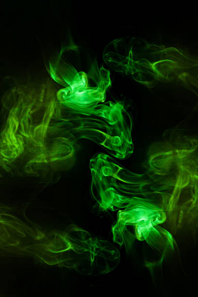 istock Green smoke motion on black background. 1435743218