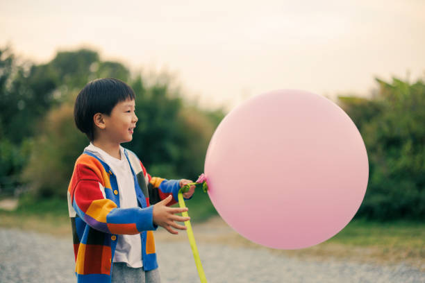 Low Angle View Of Balloons Against Sky