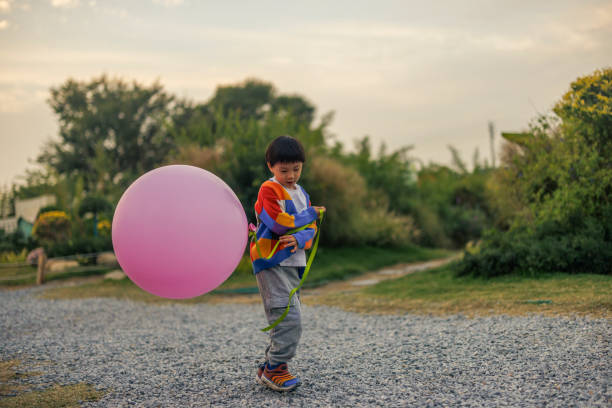 Isolated Pink Balloon with Curly String for Celebrations