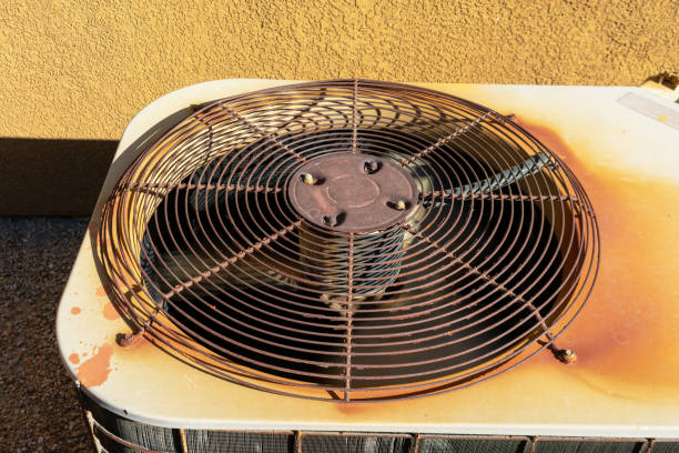 istock Rusty air conditioning unit machine outside stucco wall red rock 1435750831